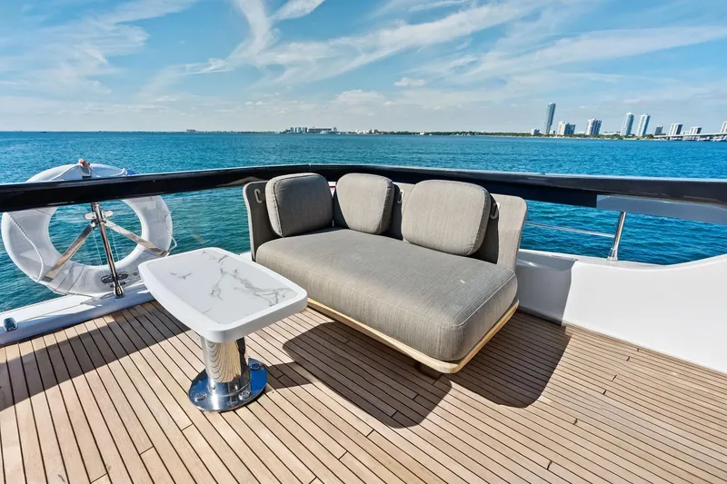 Slide: The Image of Luxurious Azimut Fly 78 yacht deck with modern seating, ocean view, and city skyline. - 41