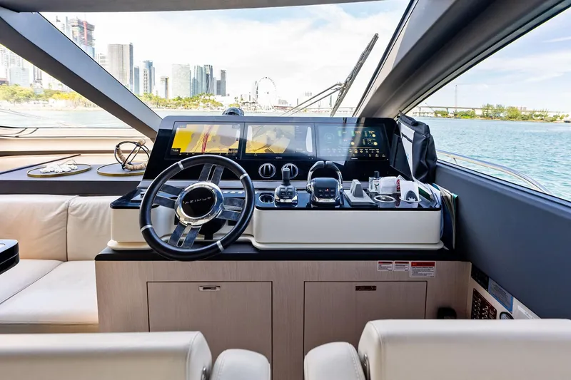 Slide: The Image of Luxurious helm of 2021 Azimut Fly 78 yacht with modern controls and city skyline view. - 67
