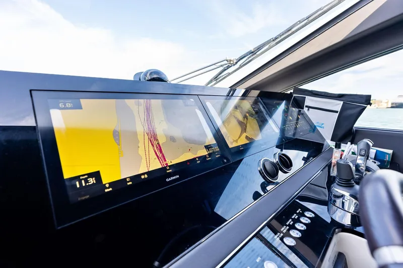 Slide: The Image of Cockpit of 2021 Azimut Fly 78 yacht with advanced navigation displays. - 68