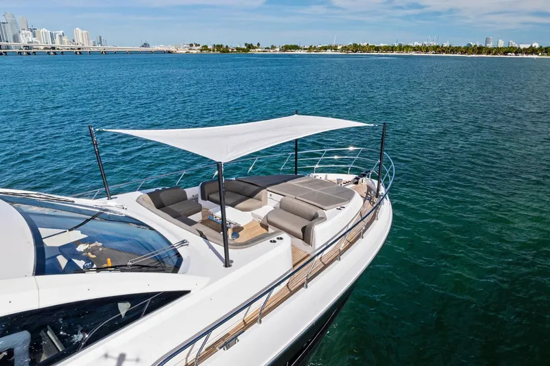 Slide: The Image of Luxurious 2021 Azimut Fly 78 yacht with sunshade, cruising near city skyline. - 7