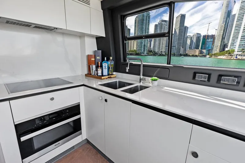 Slide: The Image of Modern kitchen interior on 2021 Azimut Fly 78 yacht with cityscape view. - 73