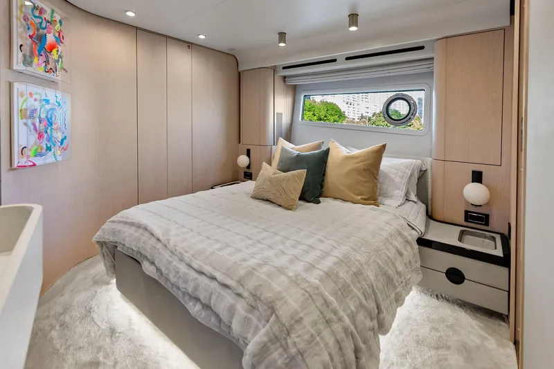 Slide: The Image of Luxurious bedroom interior of 2021 Azimut Fly 78 yacht with modern decor and window view. - 84
