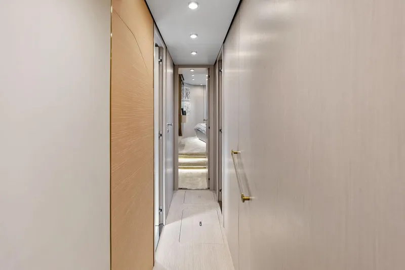 Slide: The Image of Interior hallway of 2021 Azimut Fly 78 yacht, featuring modern design and lighting. - 87