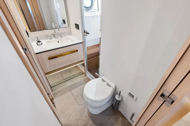 Slide: The Image of Luxurious bathroom in 2021 Azimut Fly 78 yacht, featuring modern fixtures and elegant design. - 89