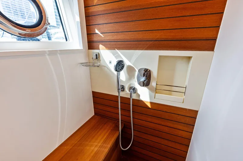 Slide: The Image of Luxurious shower area on 2021 Azimut Fly 78 yacht with wooden accents. - 90