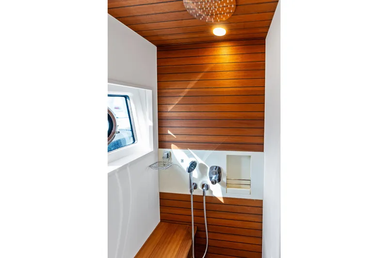Slide: The Image of Luxurious shower area in 2021 Azimut Fly 78 yacht with wood paneling. - 92