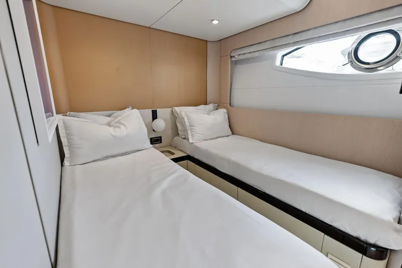 Slide: The Image of Interior of 2021 Azimut Fly 78 yacht cabin with twin beds and modern decor. - 93