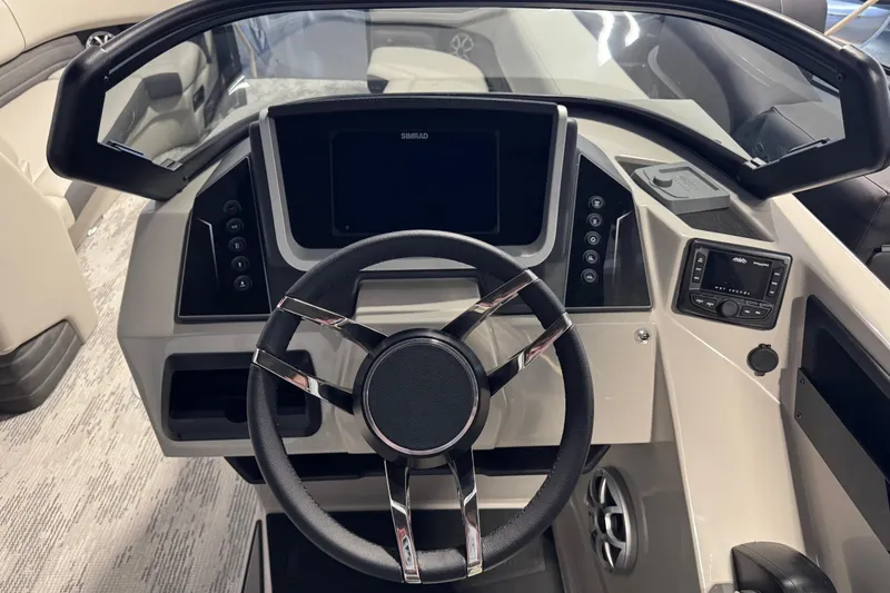 Slide: The Image of 2026 Sylvan G5 CLZ boat dashboard with modern steering wheel and control panel. - 15