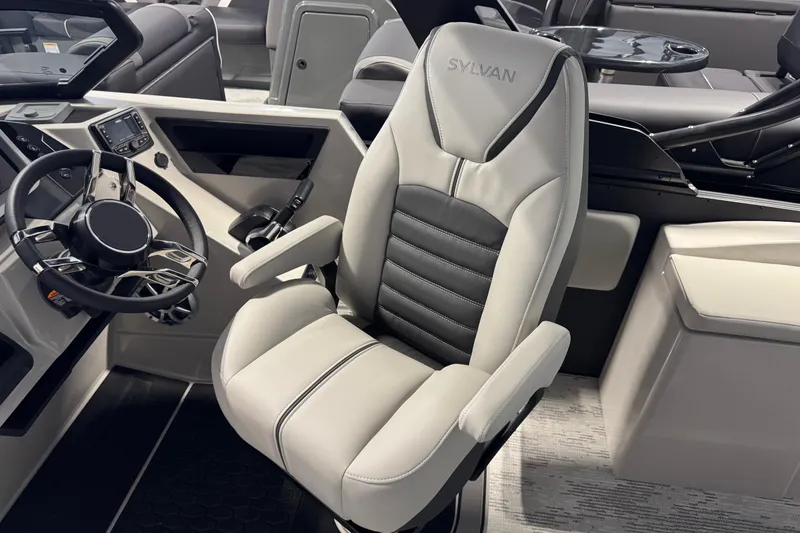 Slide: The Image of Luxurious Sylvan G5 CLZ 2026 boat interior with sleek captain's chair and modern dashboard. - 16