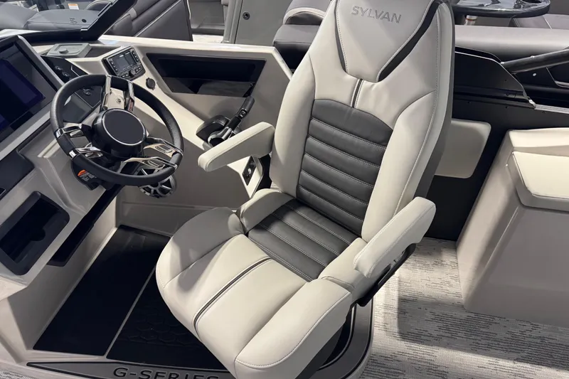 Slide: The Image of Captain's seat and steering of 2026 Sylvan G5 CLZ boat, featuring modern design. - 17