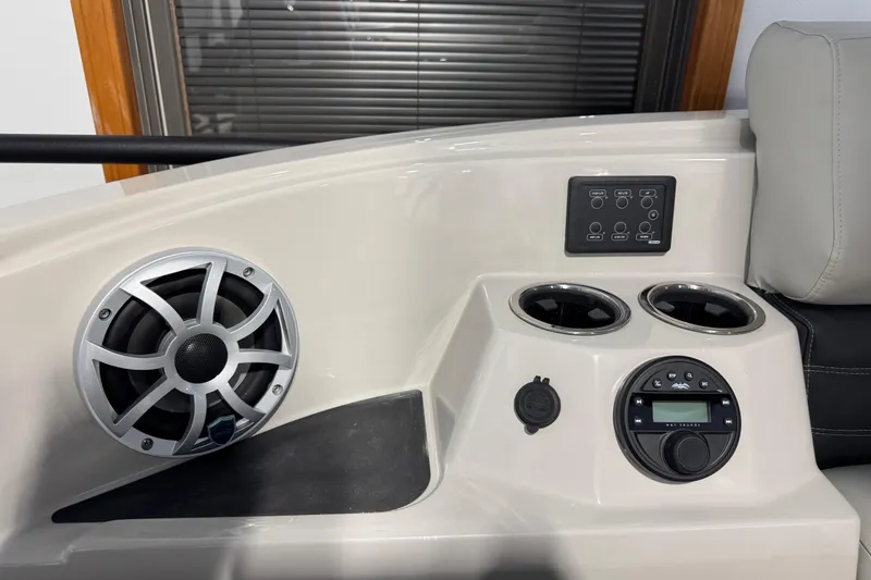 Slide: The Image of 2026 Sylvan G5 CLZ boat console with speaker, control panel, and cup holders. - 22
