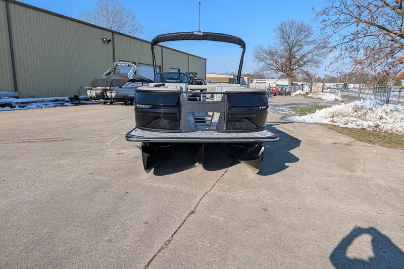 Slide: The Image of 2026 Sylvan G5 CLZ pontoon boat parked on a snowy lot under clear blue sky. - 4