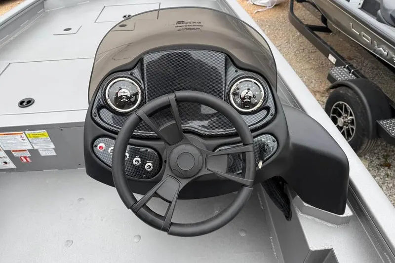 Slide: The Image of Steering console of 2026 Lowe Outlet 20 boat with modern controls. - 10