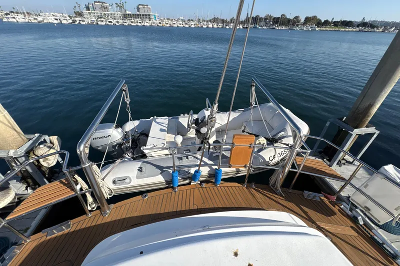 Slide: The Image of Deck view of 2001 North Wind 56 yacht with inflatable boat and Honda motor. - 11