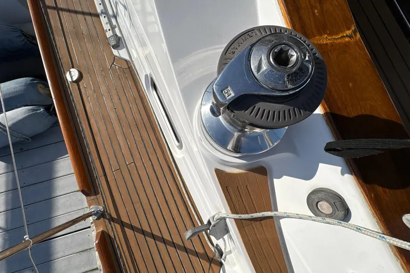 Slide: The Image of Deck of 2001 North Wind 56 yacht featuring a winch and teak wood finish. - 13