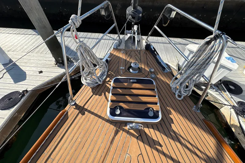 Slide: The Image of Deck of 2001 North Wind 56 sailboat with ropes and wooden finish. - 3