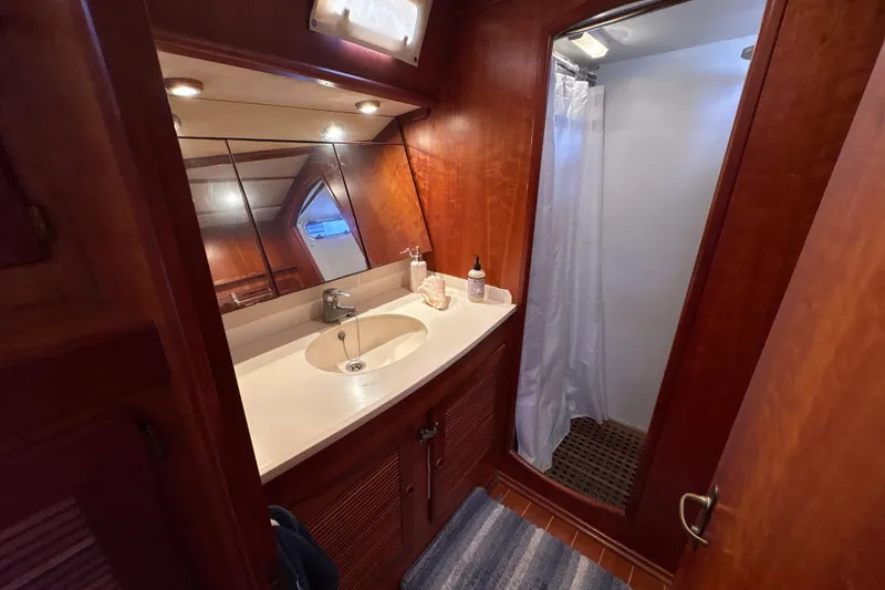 Slide: The Image of Luxurious bathroom in 2001 North Wind 56 yacht with wooden cabinetry and shower. - 37