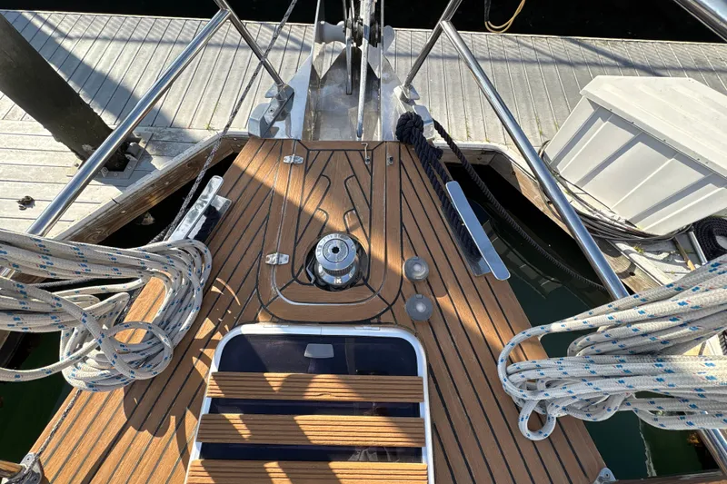 Slide: The Image of Deck of 2001 North Wind 56 sailboat with ropes and winch at dock. - 5