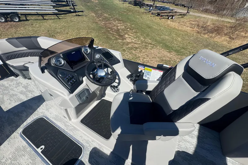 Slide: The Image of 2026 Sylvan L3 DLZ boat cockpit with modern steering and controls. - 13