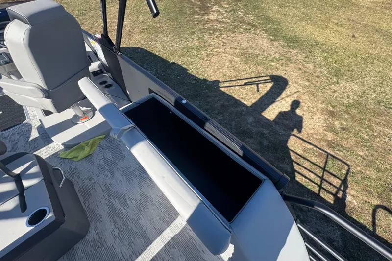 Slide: The Image of 2026 Sylvan L3 DLZ boat interior with seating and storage compartment. - 16