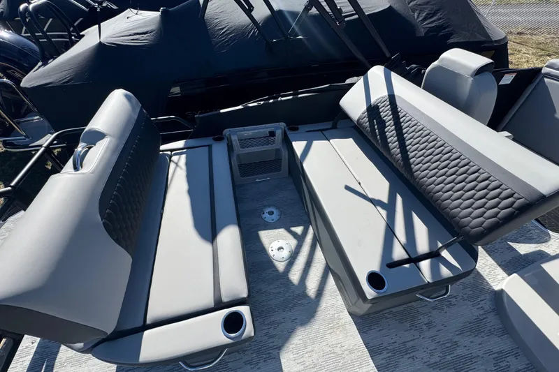 Slide: The Image of 2026 Sylvan L3 DLZ boat interior with gray seating and cup holders. - 20