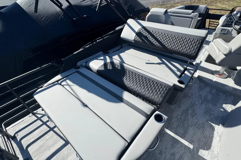Slide: The Image of 2026 Sylvan L3 DLZ boat interior with adjustable seating and cup holders. - 22