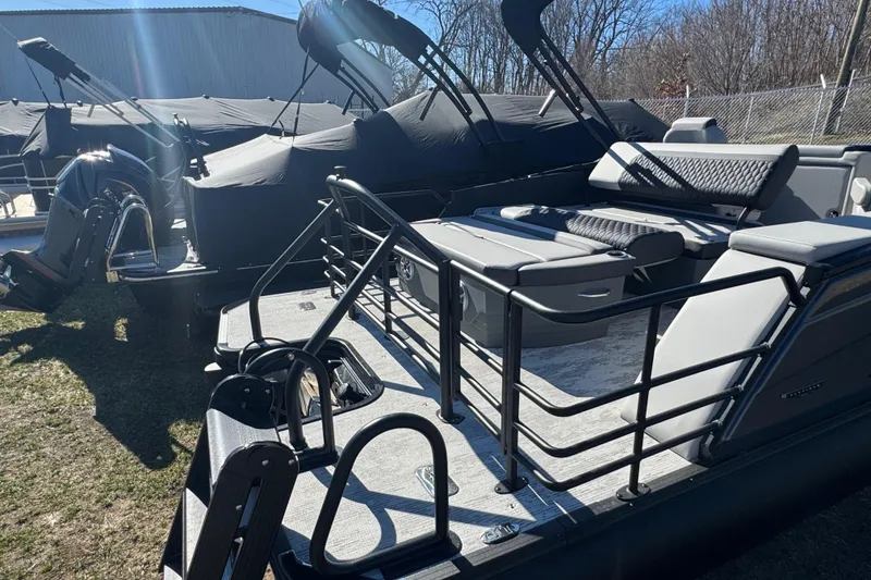 Slide: The Image of 2026 Sylvan L3 DLZ pontoon boat with sleek seating and modern design. - 24