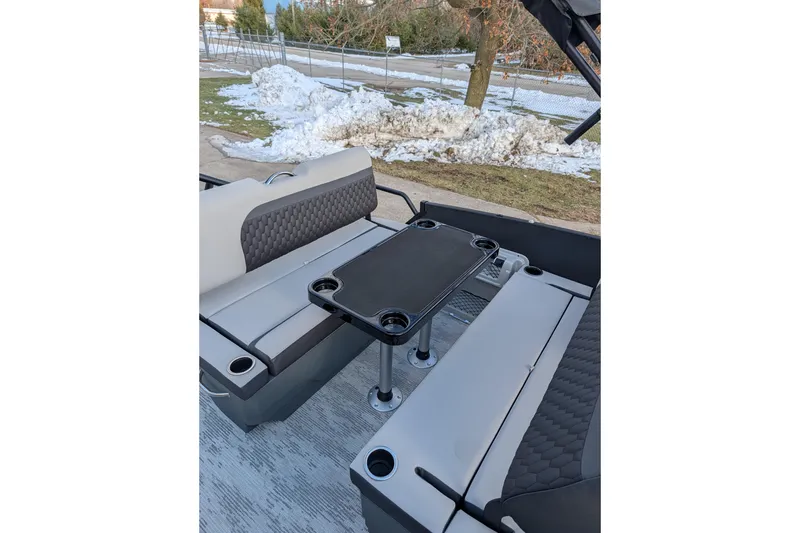 Slide: The Image of Interior of 2026 Sylvan L3 DLZ pontoon boat with seating and table. - 6