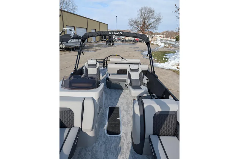 Slide: The Image of 2026 Sylvan L3 DLZ pontoon boat with modern seating and sleek design. - 8