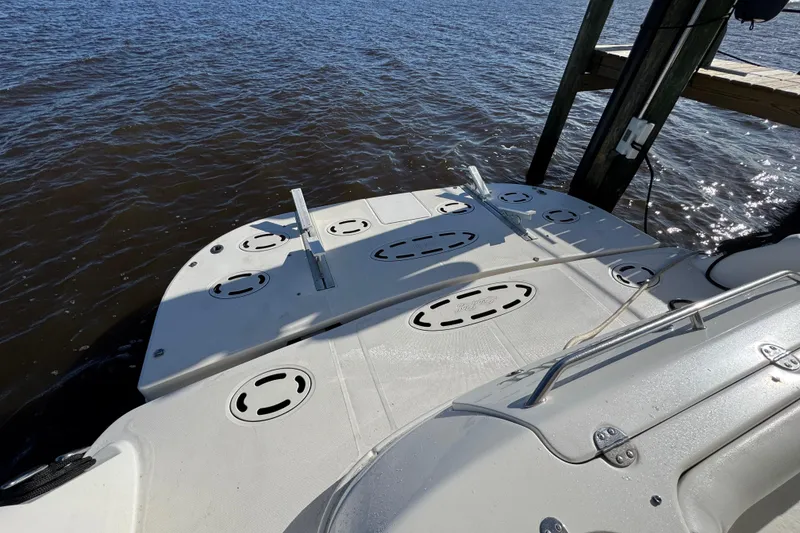 Slide: The Image of 2007 Sea Ray 58 Sedan Bridge swim platform by the water. - 13