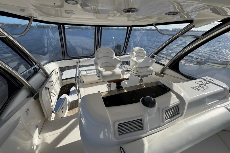 Slide: The Image of 2007 Sea Ray 58 Sedan Bridge yacht interior with helm and panoramic windows. - 19