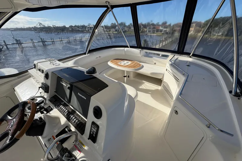 Slide: The Image of 2007 Sea Ray 58 Sedan Bridge helm with panoramic views and modern navigation equipment. - 22