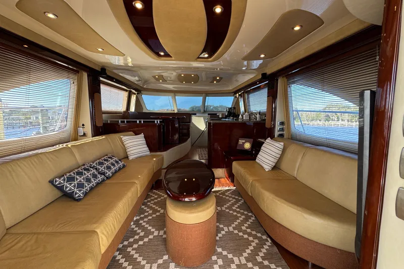 Slide: The Image of Luxurious interior of 2007 Sea Ray 58 Sedan Bridge yacht with elegant seating and decor. - 26