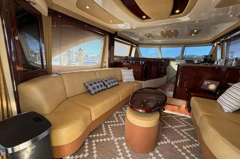 Slide: The Image of Luxurious interior of a 2007 Sea Ray 58 Sedan Bridge yacht with elegant seating and decor. - 27