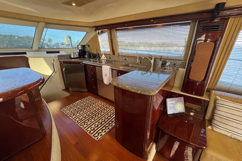 Slide: The Image of Luxurious interior of 2007 Sea Ray 58 Sedan Bridge yacht with modern kitchen amenities. - 31