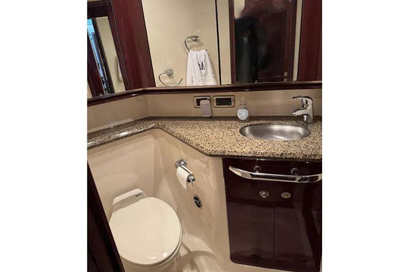 Slide: The Image of Luxurious bathroom in 2007 Sea Ray 58 Sedan Bridge yacht with granite countertop. - 36