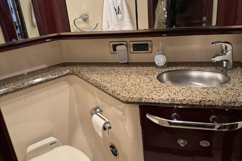 Slide: The Image of Luxurious bathroom in 2007 Sea Ray 58 Sedan Bridge yacht with granite countertop. - 37