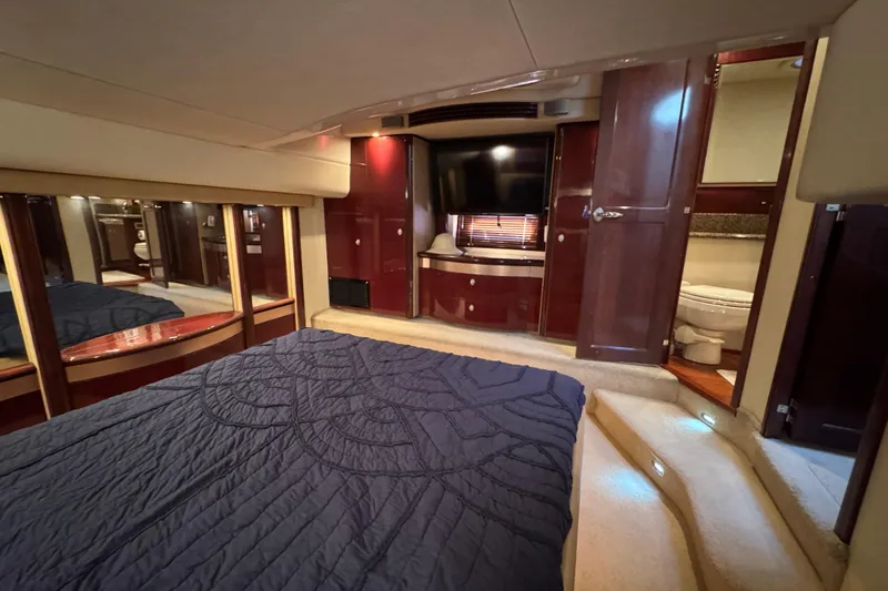 Slide: The Image of Luxurious 2007 Sea Ray 58 Sedan Bridge yacht bedroom with elegant wood finishes. - 45
