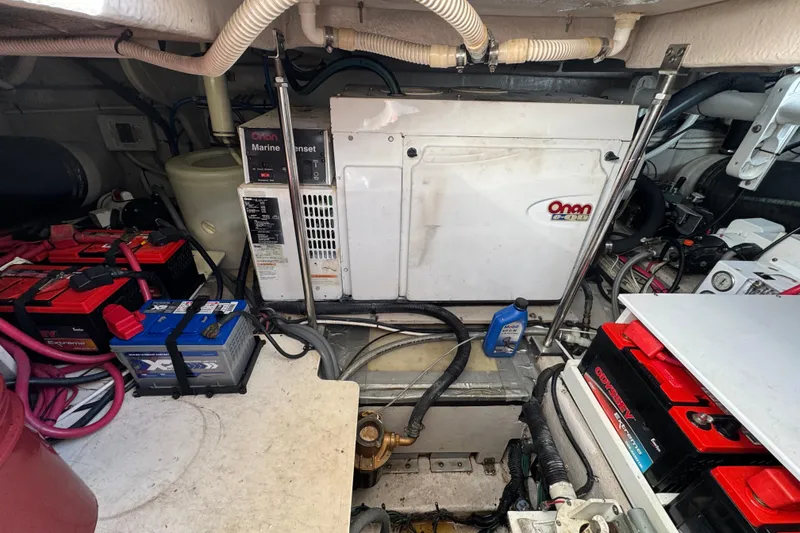 Slide: The Image of Engine room of a 2007 Sea Ray 58 Sedan Bridge with Onan marine genset and batteries. - 50