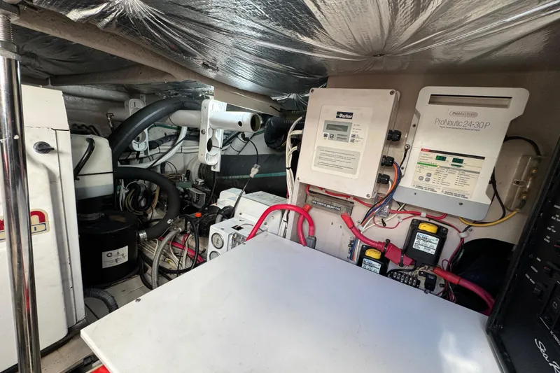 Slide: The Image of Engine room of 2007 Sea Ray 58 Sedan Bridge with electrical panels and wiring. - 51