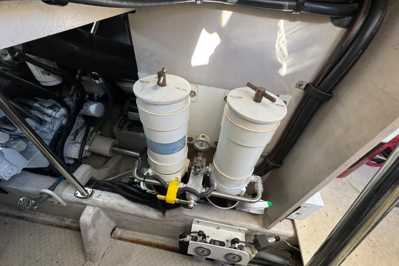 Slide: The Image of Engine compartment of a 2007 Sea Ray 58 Sedan Bridge with dual fuel filters. - 53