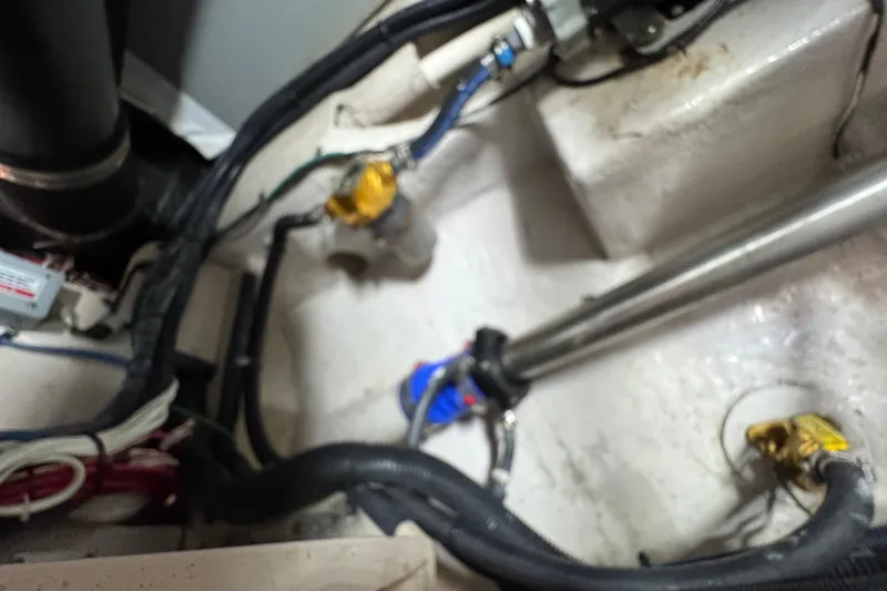 Slide: The Image of Engine compartment of 2007 Sea Ray 58 Sedan Bridge with visible wiring and components. - 54