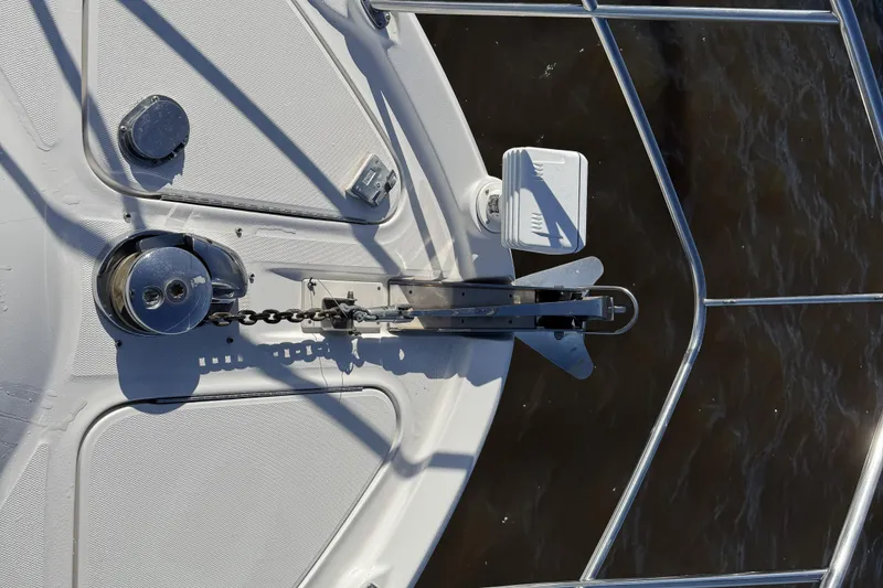 Slide: The Image of 2007 Sea Ray 58 Sedan Bridge anchor system on deck, featuring chain and winch. - 8