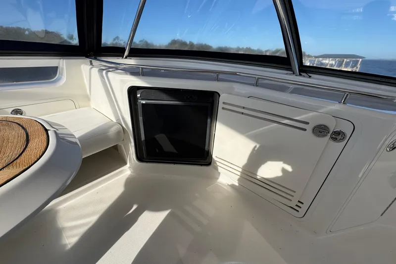 Slide: The Image of 2007 Sea Ray 58 Sedan Bridge interior with seating and storage compartments. - 17