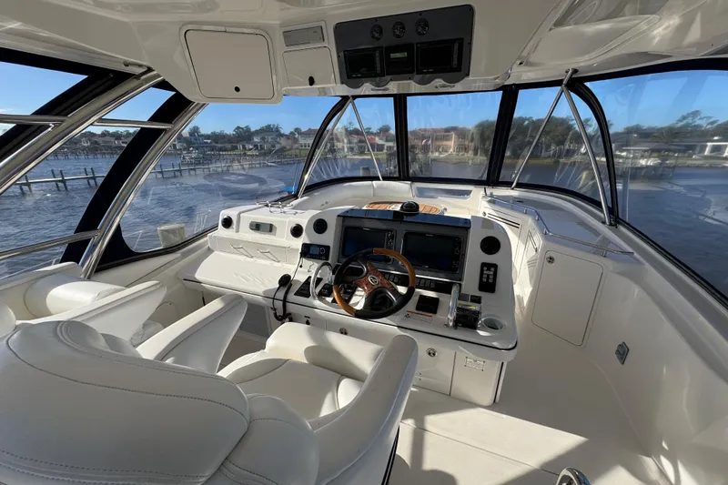 Slide: The Image of 2007 Sea Ray 58 Sedan Bridge helm with panoramic views and modern navigation equipment. - 21