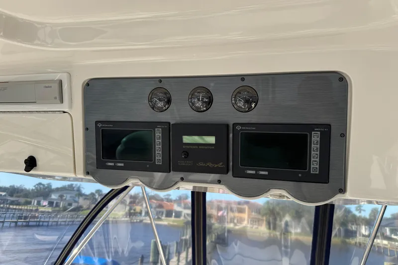 Slide: The Image of 2007 Sea Ray 58 Sedan Bridge dashboard with gauges and electronic displays. - 24