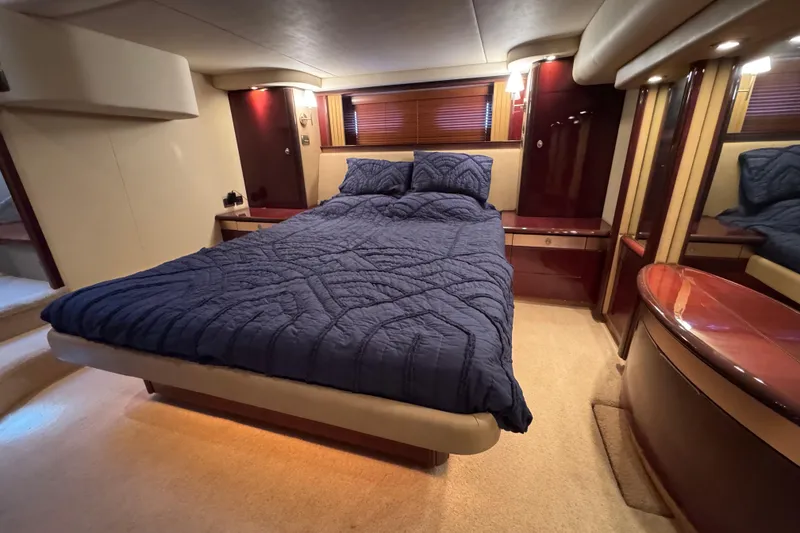 Slide: The Image of Luxurious bedroom interior of 2007 Sea Ray 58 Sedan Bridge yacht with elegant furnishings. - 43
