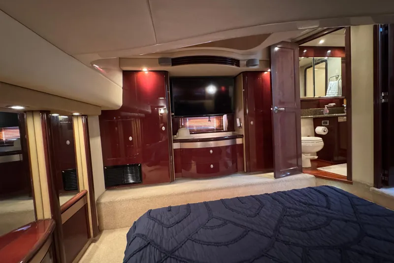 Slide: The Image of Luxurious interior of 2007 Sea Ray 58 Sedan Bridge yacht with elegant wood finishes. - 46