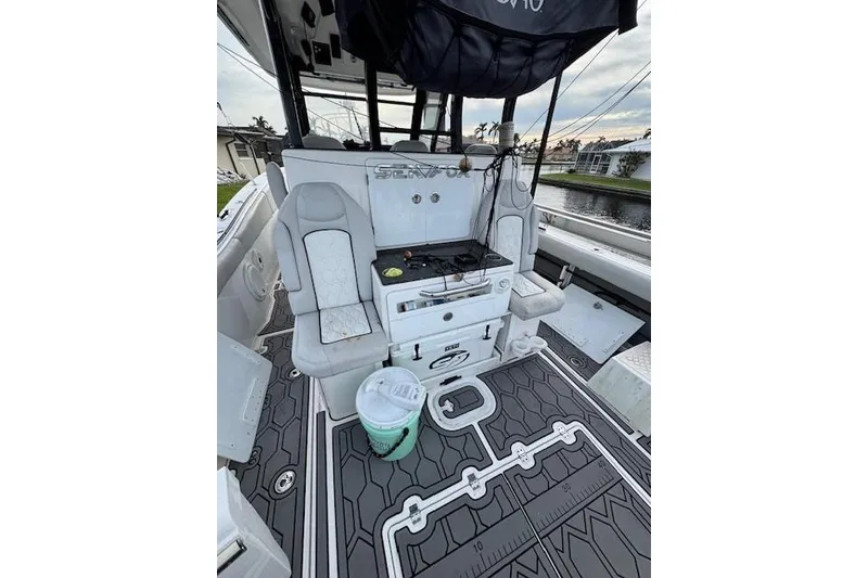 Slide: The Image of 2021 Sea Fox 368 Commander boat interior with seating and fishing equipment. - 4