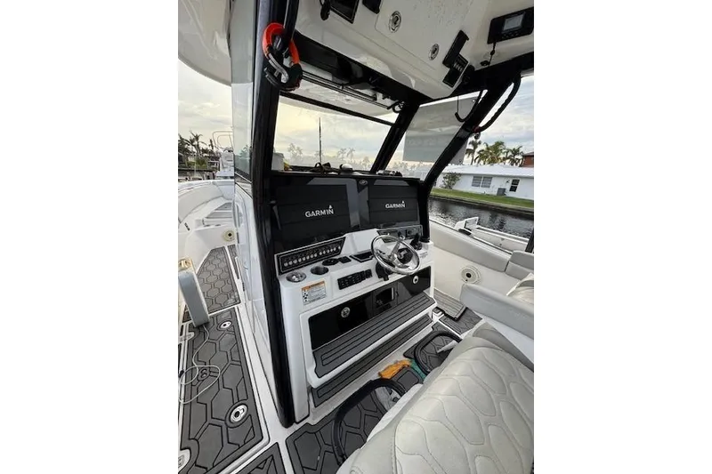 Slide: The Image of 2021 Sea Fox 368 Commander helm with Garmin displays and luxurious seating. - 5